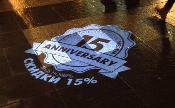 15th Anniversary sale logo projected on floor by One Gobo.