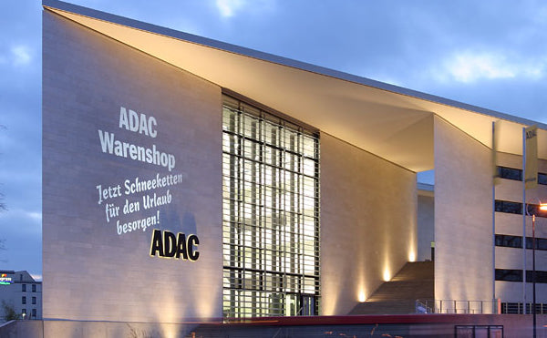 ADAC logo projection on modern building façade by One Gobo.